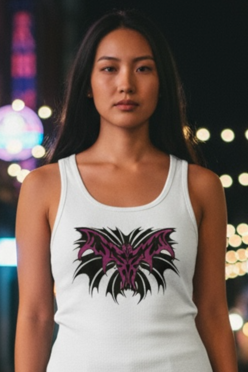 Woman wearing a white tank top with a black and purple design against a blurred background